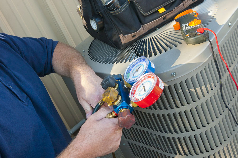 technician working on hvac unit